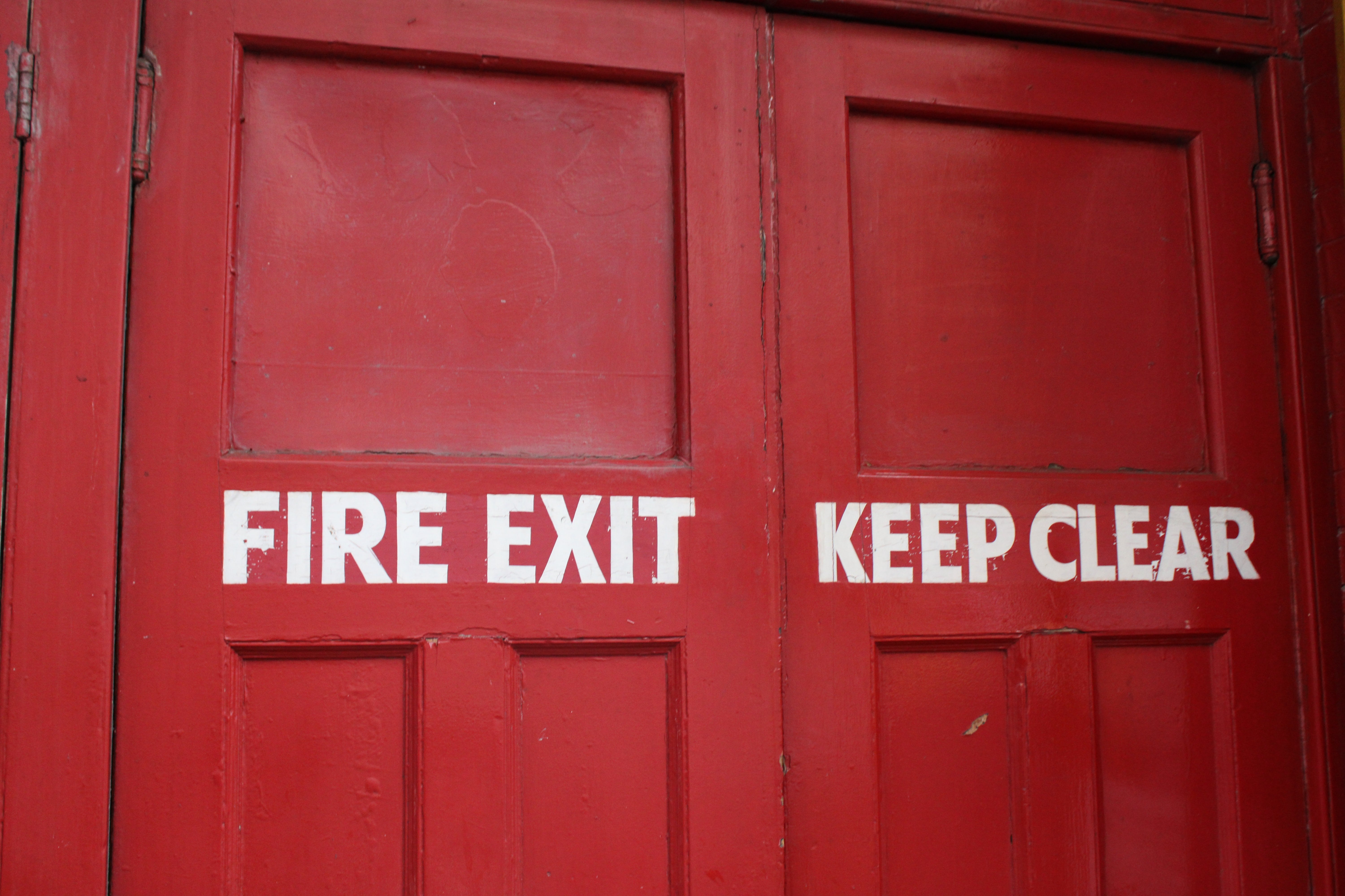 Fire door featuring vital components such as fire exit keep clear lettering 