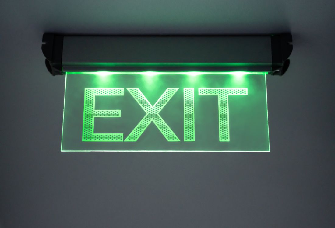 A well lit and prominently displayed exit sign that is an integral part of a buildings well maintained emergency lighting system